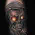 3D style very realistic looking forearm tattoo of demonic skull