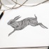 Amazing-printed rushing forward hare tattoo design