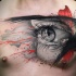 Awesome abstract eye tattoo on chest
