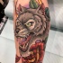 Awesome colorful wolf head tattoo on arm