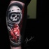 Awesome dead astronaut tattoo on arm