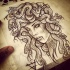Awesome grey-ink medusa gorgona with stoned eyes tattoo design