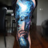 Awesome woman and space tattoo on leg