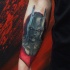 Tatuaje de cabeza de Batman en el antebrazo