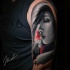 Beautifull girl face tattoo on shoulder