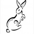 Black-and-grey tribal standing rabbit tattoo design by The Heat Of The Art