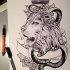 Black-and-white lion and snake with crown and ribbon tattoo design