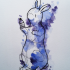 Black-contour rabbit with blue watercolor fur tattoo design