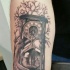 Clessidra nera con albero dell'avambraccio tatoo