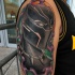 Black panther tattoo on shoulder