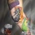 Tatuaje de ratón y queso de dibujos animados