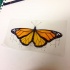 Charming bright orange butterfly with hanging necklace tattoo design