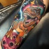 Colorful dinosaur in space tattoo