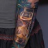Colorful hourglass tattoo on forearm