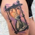 Clessidra colorata con tatuaggio sulla coscia di cahdle