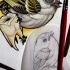 Colorful new school bird and a tooth tattoo design