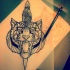 Confuced tiger head killed with a dagger tattoo design