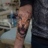 Cool leopard head tattoo on forearm
