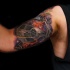 Cool star wars theme tattoo on biceps
