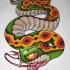 Cunning colorful new school crawling snake tattoo design