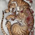 Curled colorful tiger with little roses tattoo design