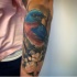 Cute bird tattoo on forearm