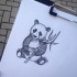 Cute dotwork panda cub with bamboo stem tattoo design