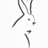 Elegant black-line hare silhouette tattoo design