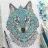 Entrancing grey-and-turquoise wolf tattoo design