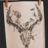 Exiting deer skull with beautiful floral horns tattoo design