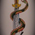 Fabulous old school snake curled around huge dagger tattoo design