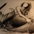 Faceless mermaid with huge scaled tail tattoo design