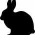 Full-black sitting rabbit silhouette tattoo design