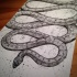 Gigant ornate snake crawling like infinity tattoo design