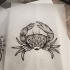 Girly grey-ink mandala-ornamented crab tattoo design