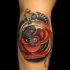Great red rose and compas tattoo on arm