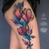 Gran tatuaje de acuarela en la cadera