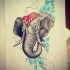 Grey elephant in red hat on blue rhombus background tattoo design