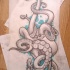 Grey octopus in blue watercolor background tattoo design