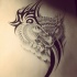 Grey patterned animal with black-ink tribal curl tattoo design