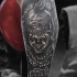 Tatuaggio horror pagliaccio sull'avambraccio