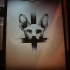 Huge-eyed sphynx cat on reversed cross background tattoo design