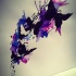 Impressive black butterfly flock flying on purple watercolor splashes tattoo design