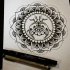 Little ornate bug in mandala circle tattoo design