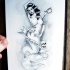 Naked mermaid with sword and banner tattoo design
