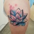 Nice watercolor lotus tattoo on shoulder