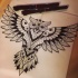 Open-winged ornamented owl tattoo design