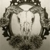 Ram skull with nice flowers on mirror frame tattoo design