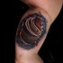 Realistic cake tattoo on biceps