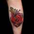 Realistic red rose and heart tattoo on leg